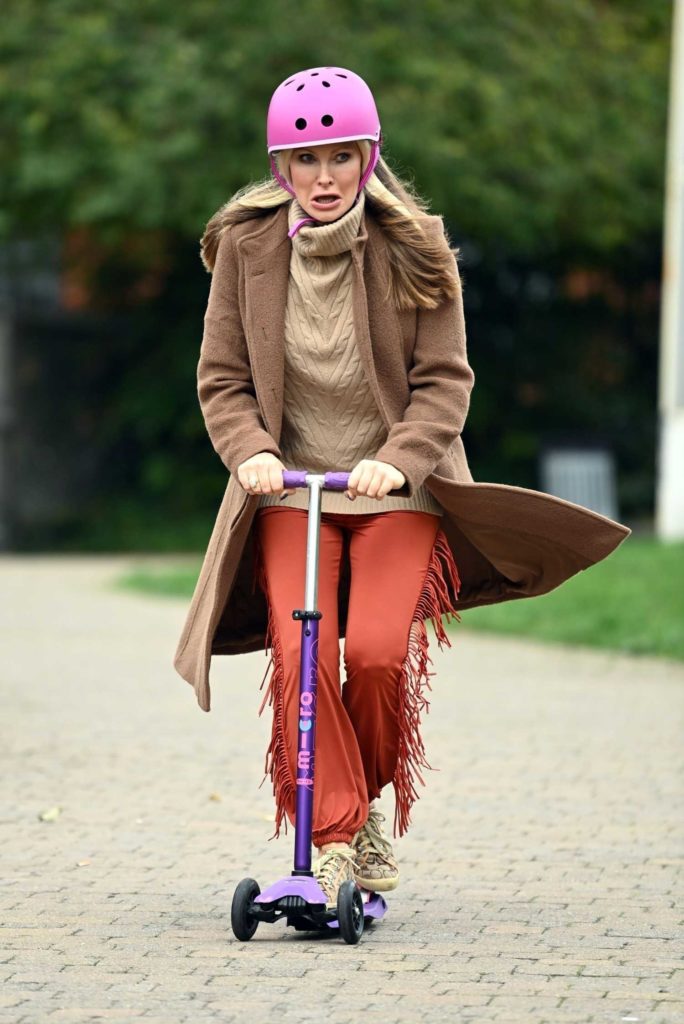 in a Red Pants Gets Around Town on Her Scooter Out in London 10/22/2020