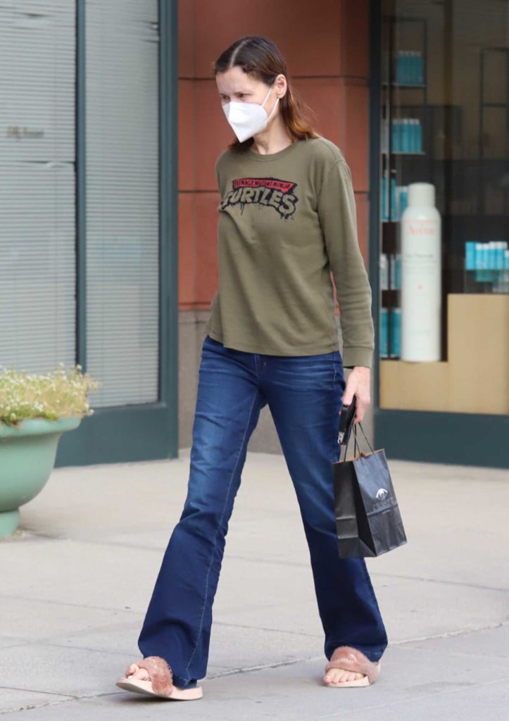 Geena Davis in an Olive Sweatshirt