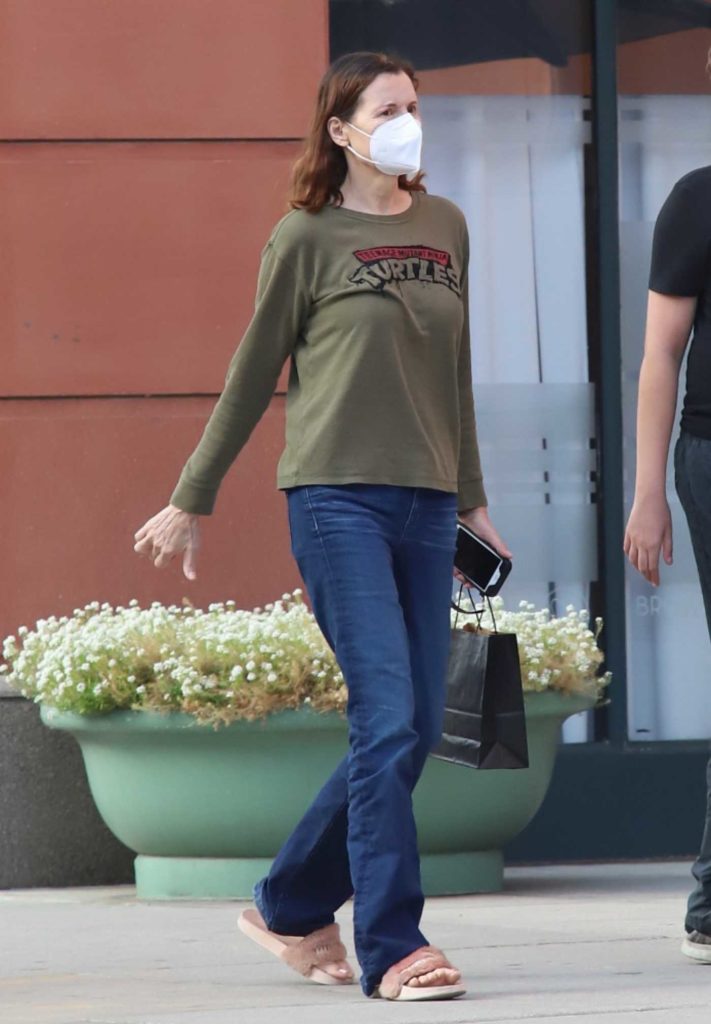 Geena Davis in an Olive Sweatshirt