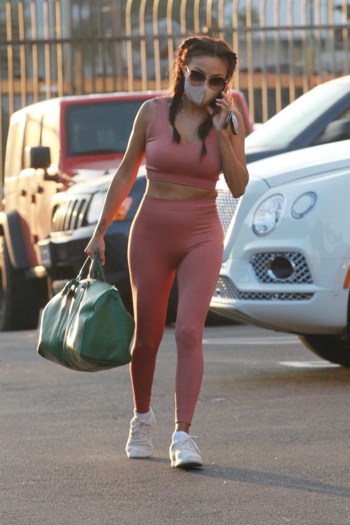 Jeannie Mai in a Pink Workout Ensemble