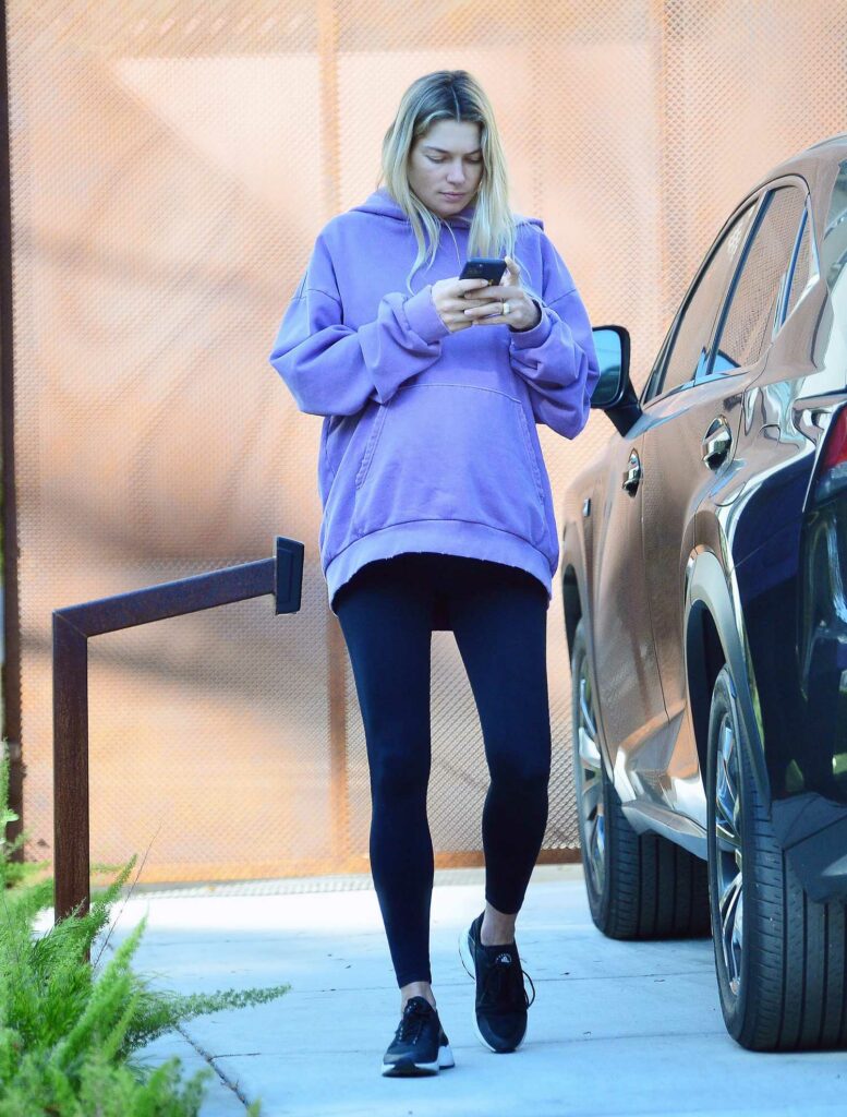 Jessica Hart in a Purple Hoodie