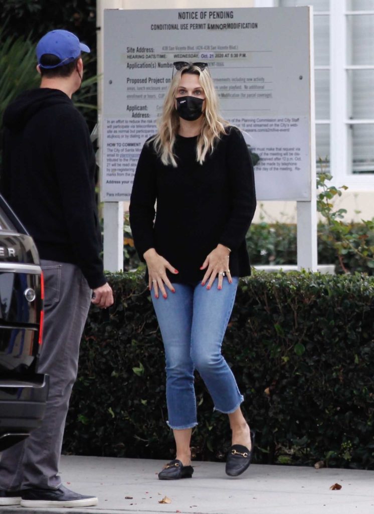 Molly Sims in a Black Protective Mask
