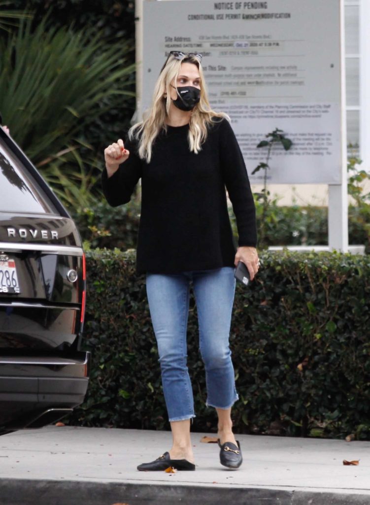 Molly Sims in a Black Protective Mask