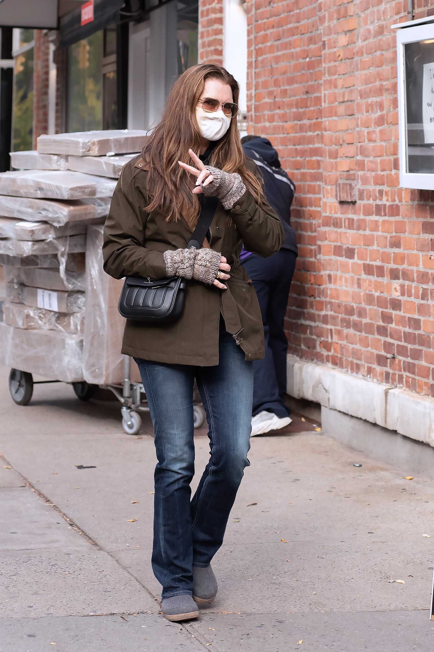 Brooke Shields in a Protective Mask Flashes a Peace Sign 