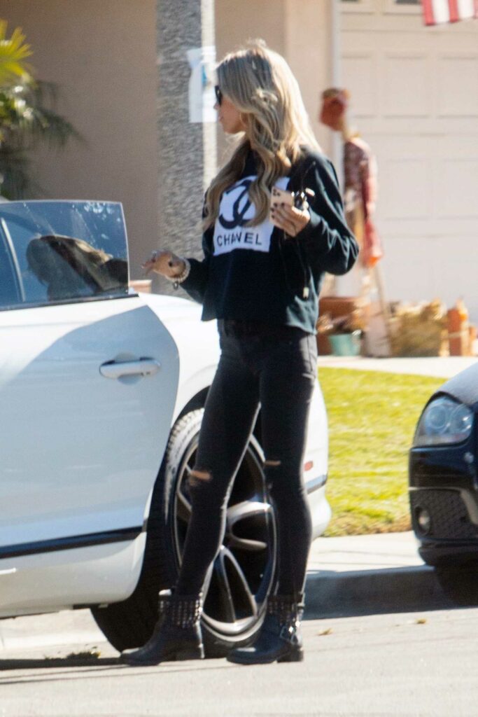 Christina Anstead in a Black Chanel Sweatshirt