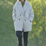 Emma Corrin in a Grey Sweatpants Walks Her Dog in North London