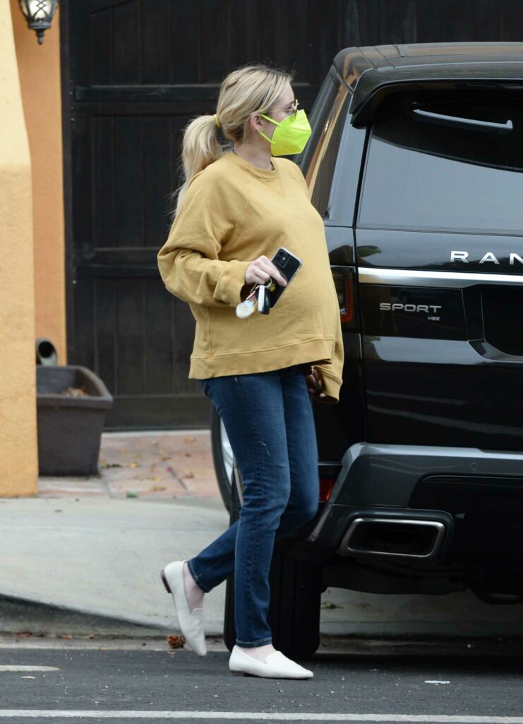 Emma Roberts in a Yellow Sweatshirt