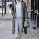 Frankie Sims in an Olive Leather Trench Coat Was Seen Out with Demi Sims in London