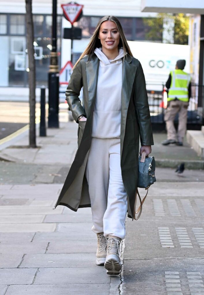 Frankie Sims in an Olive Leather Trench Coat
