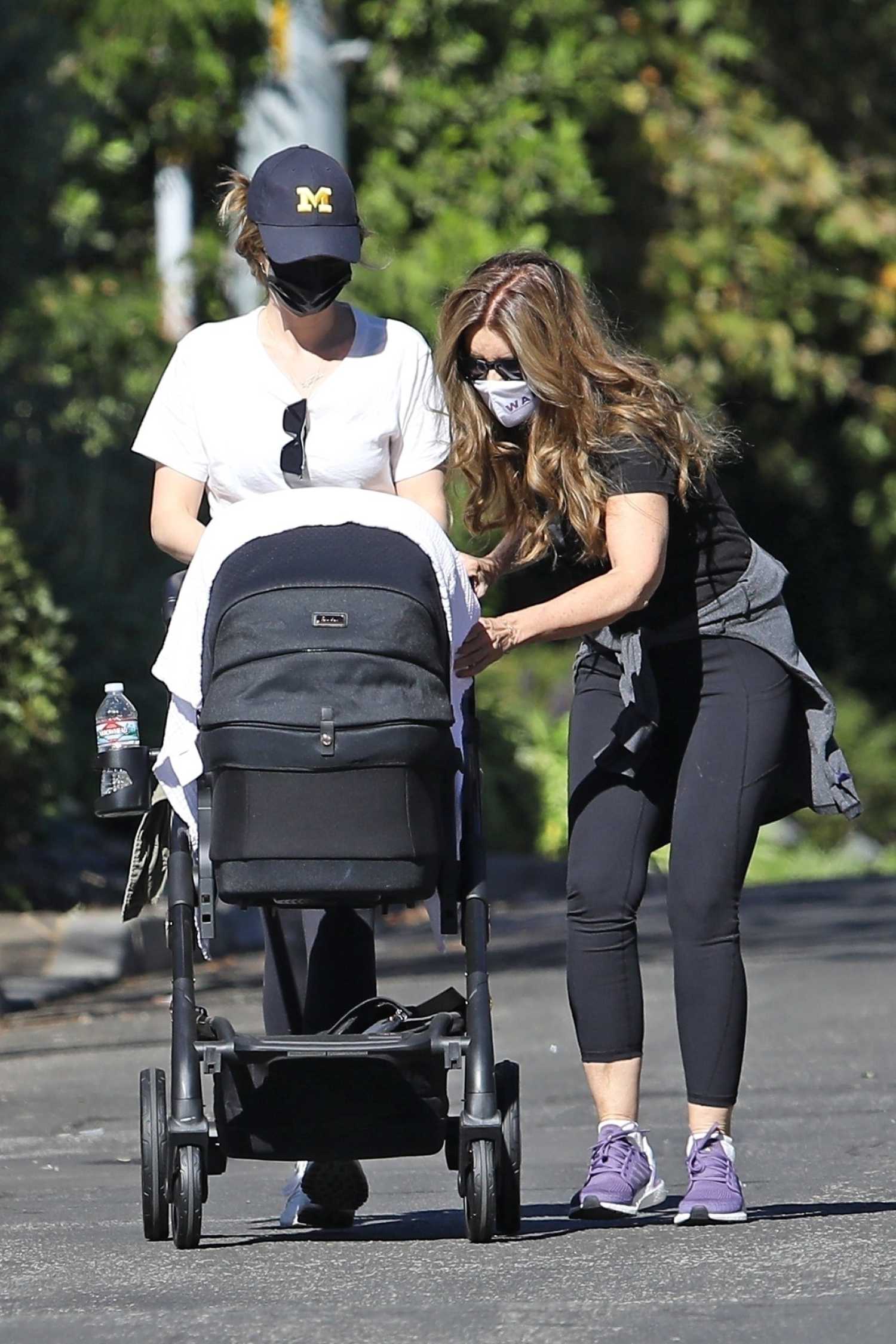 Katherine Schwarzenegger in a White Tee Enjoys a Walk with Maria