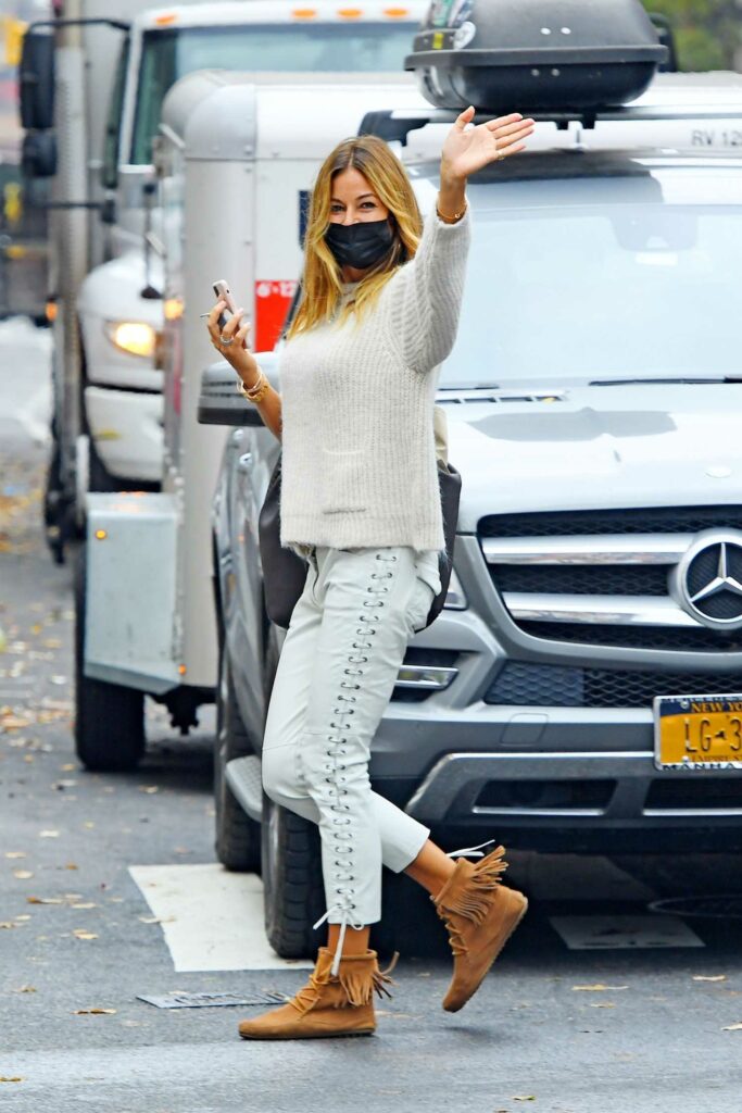 Kelly Bensimon in a Black Protective Mask