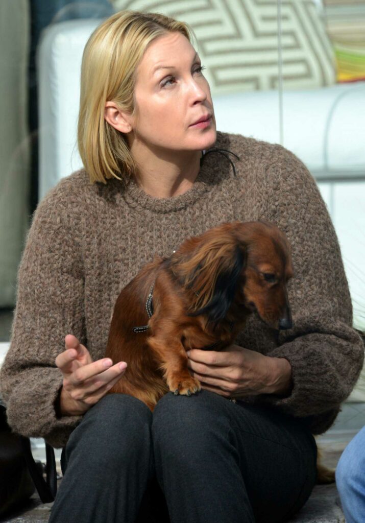 Kelly Rutherford in a Brown Sweater