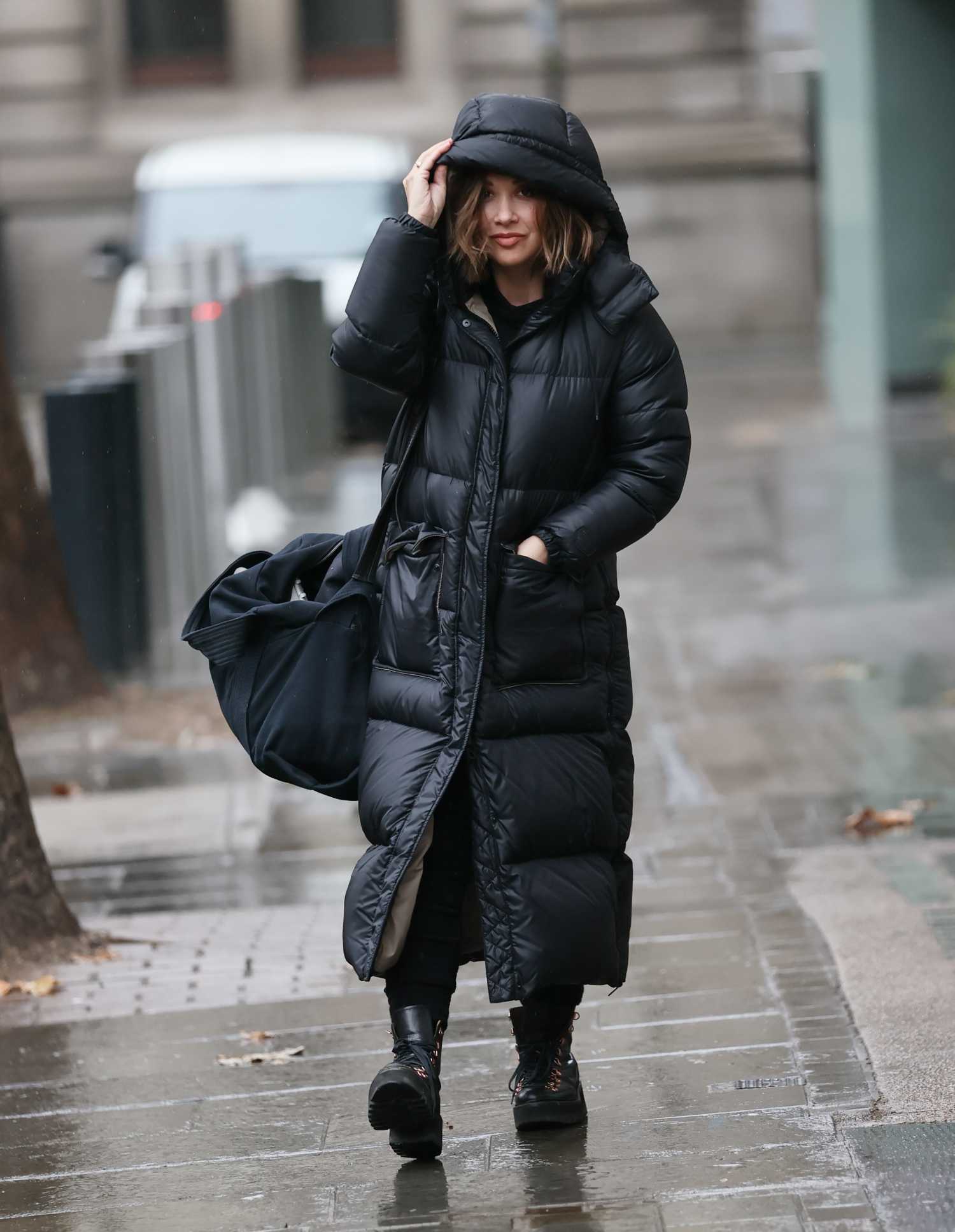 Myleene Klass in a Black Puffer Coat Arrives at the Smooth Radio in ...