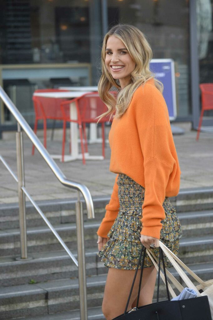 Vogue Williams in an Orange Sweater