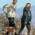 Alicia Silverstone in a Black Sweatsuit Walks Her Dog with a Mystery Guy in Los Angeles