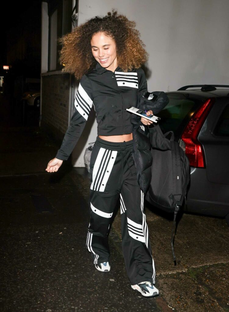 Jessica Plummer in a Black and White Tracksuit