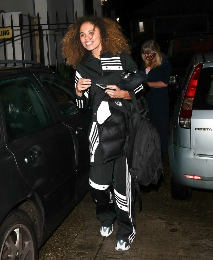 Jessica Plummer in a Black and White Tracksuit