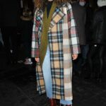 Jessica Plummer in a Plaid Coat Arrives at the Press Night for A Christmas Carol at the Dominion Theatre in London