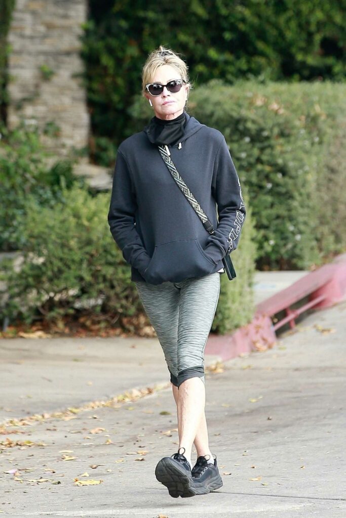 Melanie Griffith in a Black Hoodie Does a Solo Afternoon Walk in ...