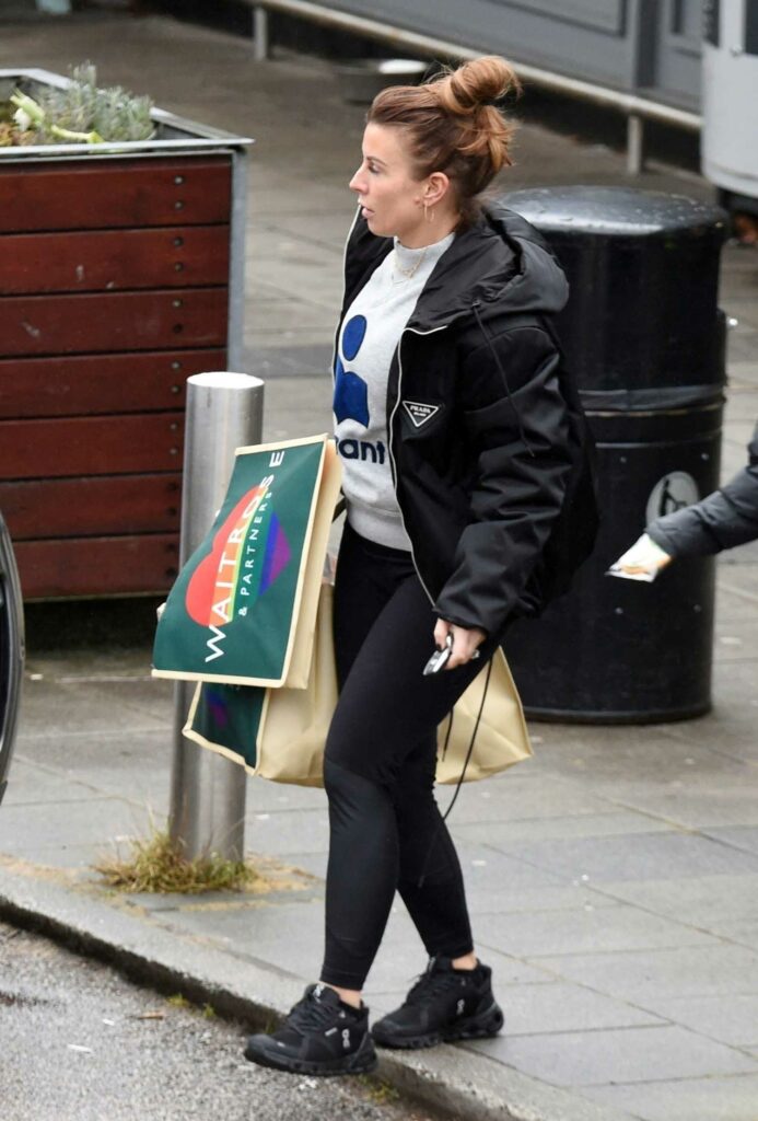 Coleen Rooney in a Black Prada Jacket