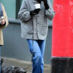 Emma Corrin in a Grey Jacket Walks Her Dog in Primrose Hill, London