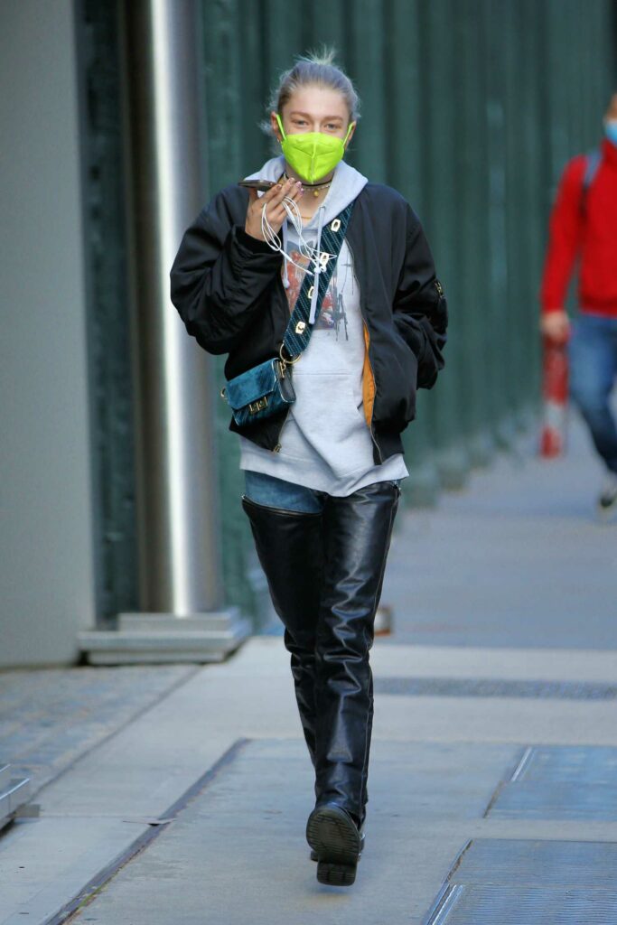 Hunter Schafer in a Neon Green Protective Mask
