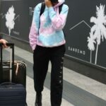 Joan Smalls in a Tie-Dye Hoodie Arrives at  Airport in Milan