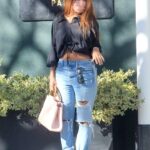 Keyshia Cole in a Blue Ripped Jeans Goes Shopping in Beverly Hills