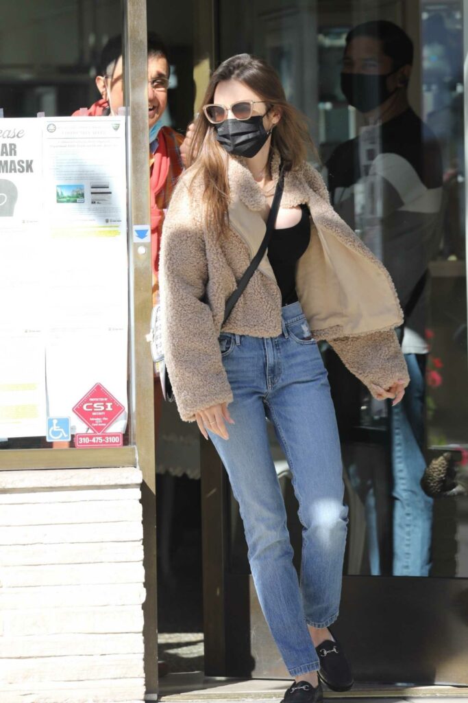Lily Collins in a Black Protective Mask