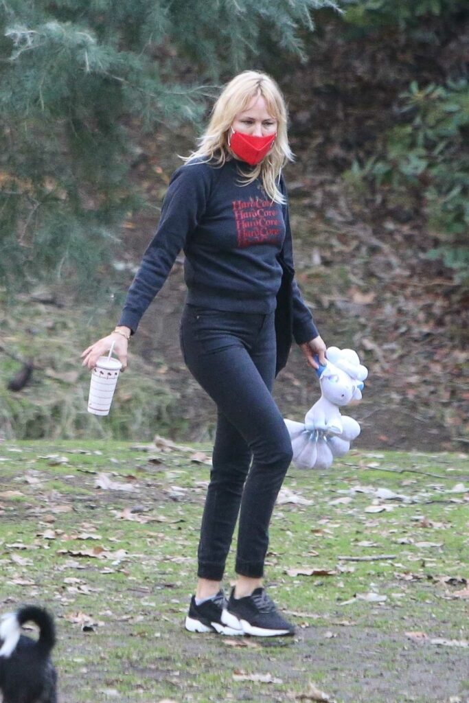 Malin Akerman in a Red Protective Mask