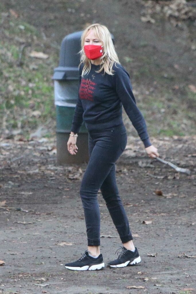 Malin Akerman in a Red Protective Mask
