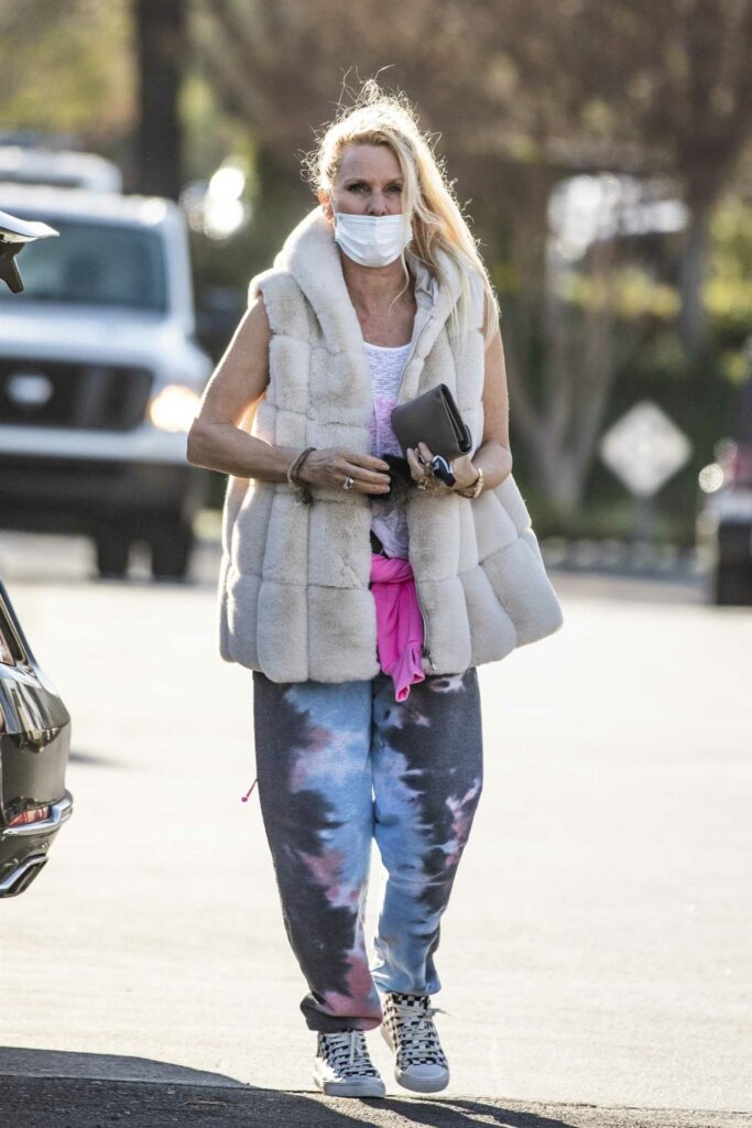 Nicollette Sheridan in a Protective Mask