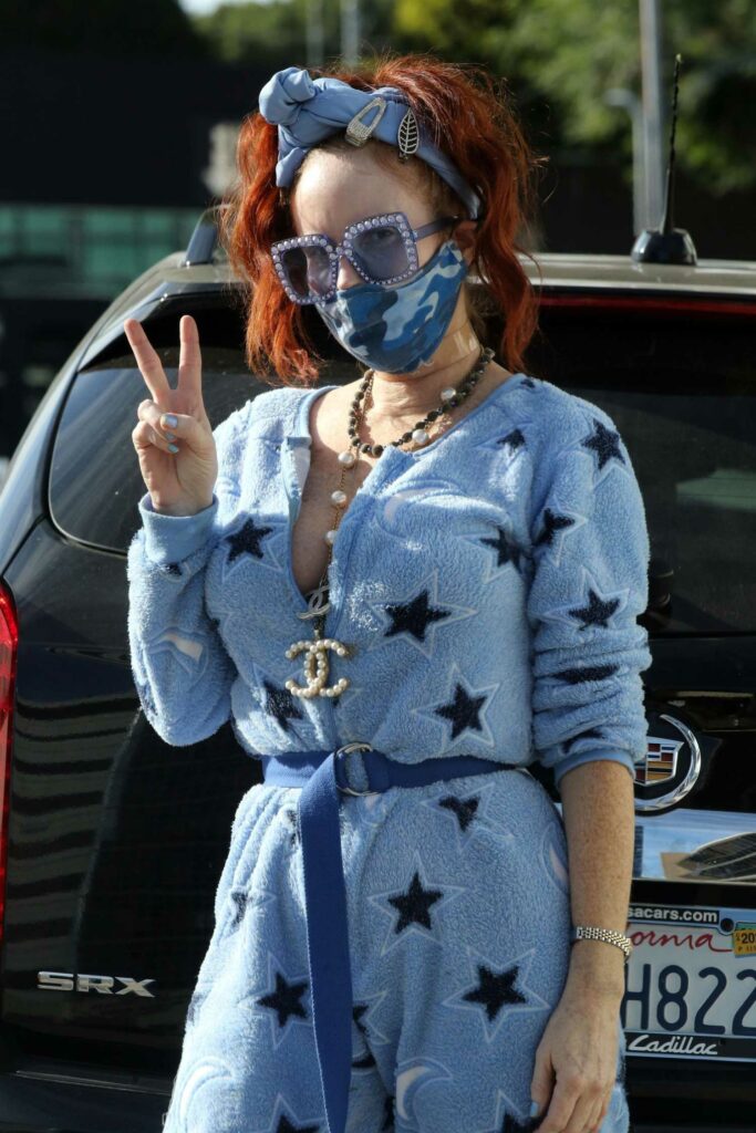 Phoebe Price in a Stars Print Blue Jumpsuit