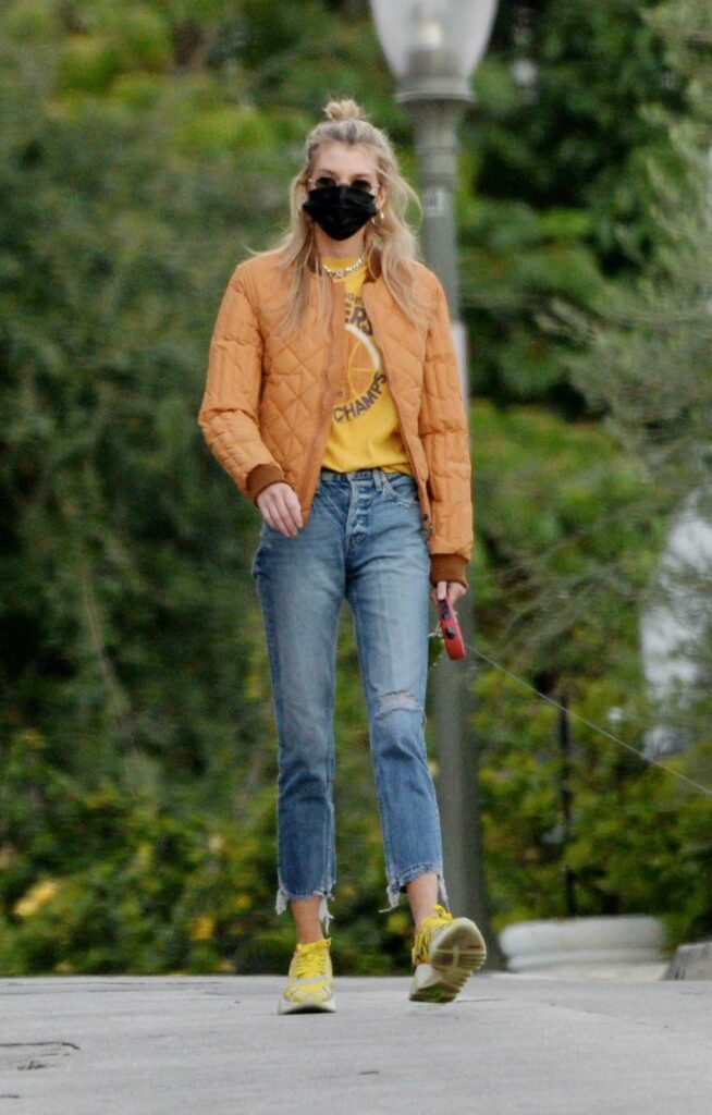 Stella Maxwell in an Orange Jacket