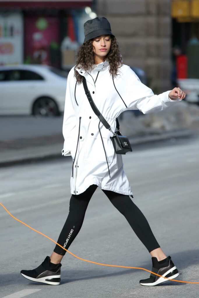 Alanna Arrington in a White Trench Coat