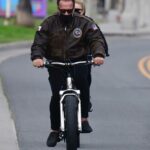 Arnold Schwarzenegger in a Brown Leather Jacket Does a Bike Ride Out with Heather Milligan in Santa Monica