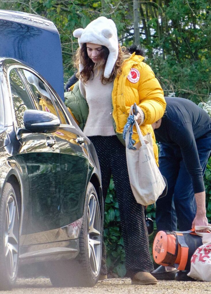 Lily James in a Yellow Puffer Jacket