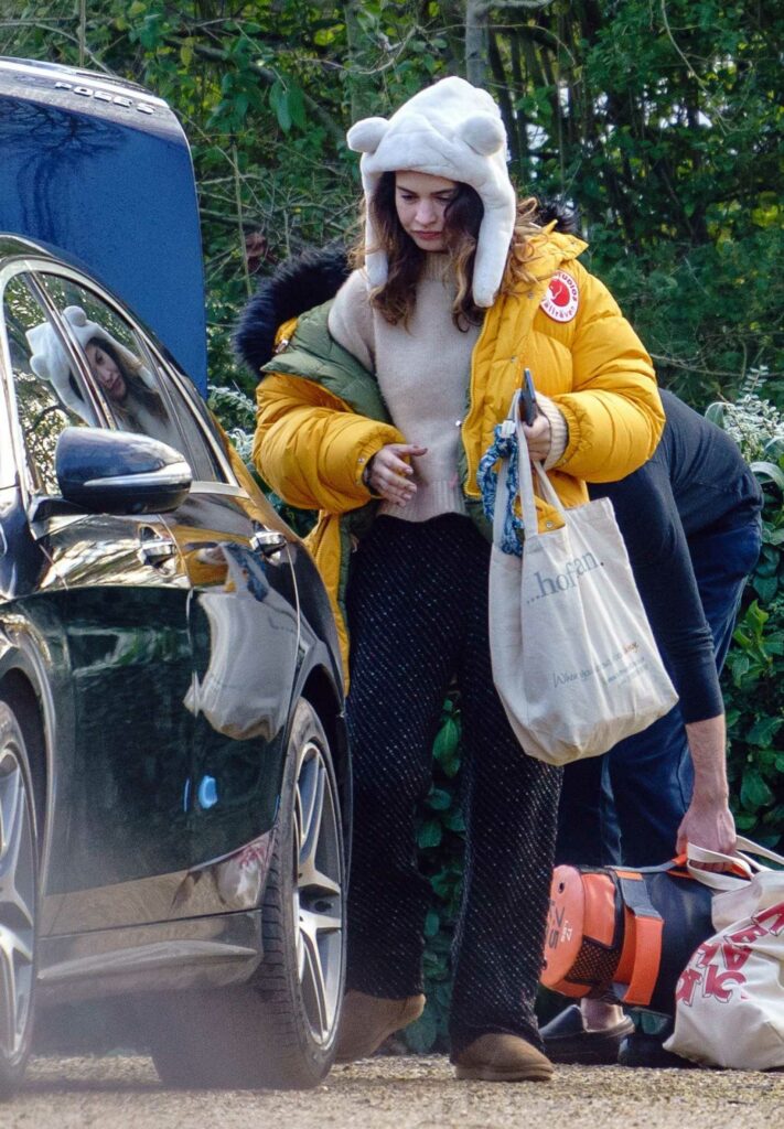 Lily James in a Yellow Puffer Jacket
