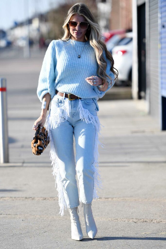 Chloe Sims in a Light Blue Sweater