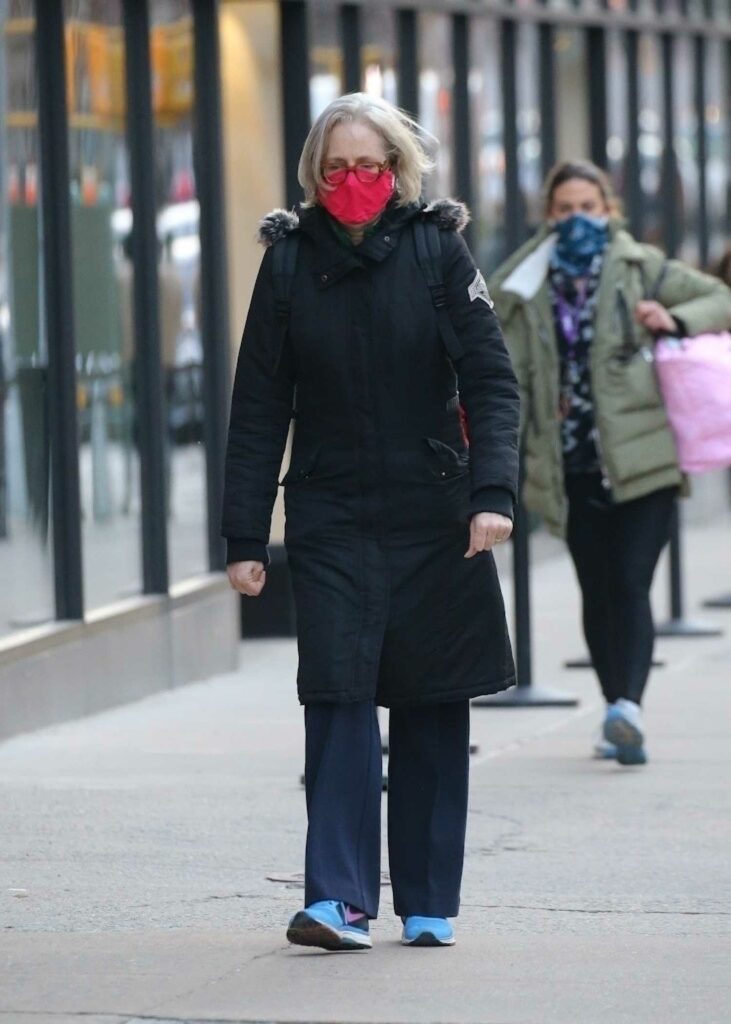 Jessica Lange in a Red Protective Mask