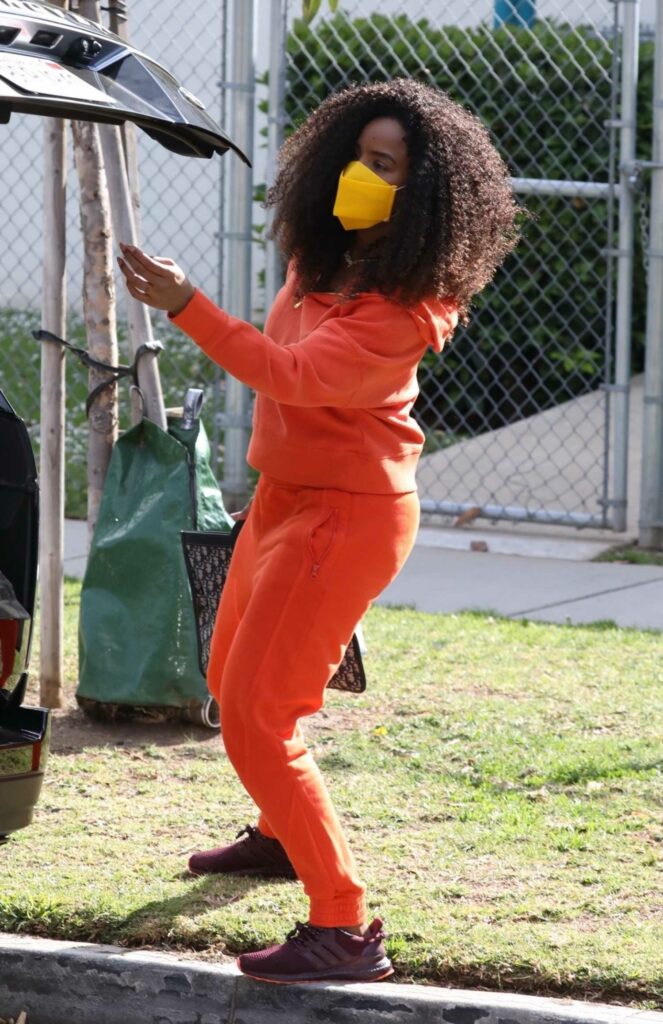 Kelly Rowland in an Orange Sweatsuit