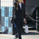 Kimberly Stewart in a Black Jumpsuit Arrives at a Gas Station in Los Angeles