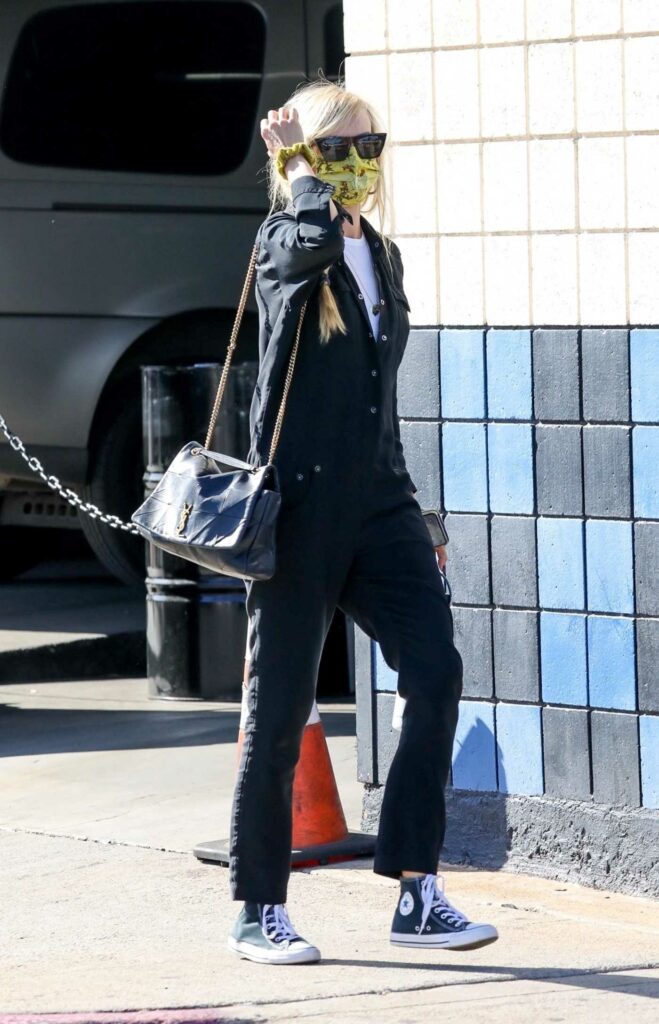Kimberly Stewart in a Black Jumpsuit