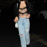 Caitlin Carmichael in a Blue Ripped Jeans Arrives at the Saddle Ranch Chop Shop in West Hollywood
