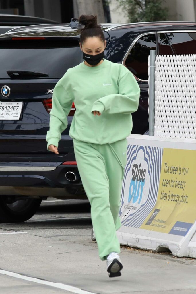 Cara Santana in a Green Sweatsuit