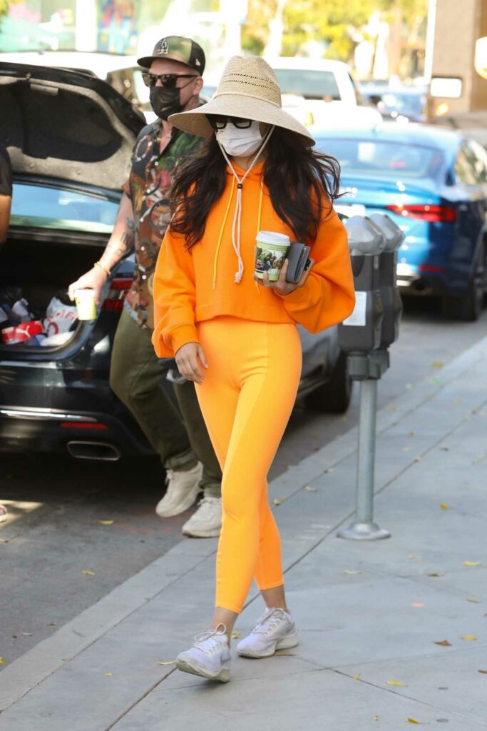 Cara Santana in an Orange Outfit