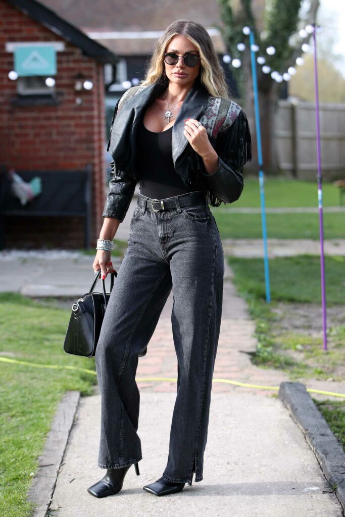 Chloe Sims in a Black Leather Jacket