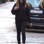 Elisabetta Canalis in a Black Hoodie Walks Her Dog in Rome