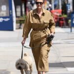 Georgina Burke in a Yellow Jumpsuit Walks Her Dog in New York