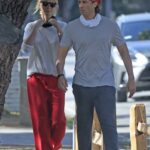Gwyneth Paltrow in a Red Sweatpants Goes for a Walk Out with Brad Falchuk in Brentwood